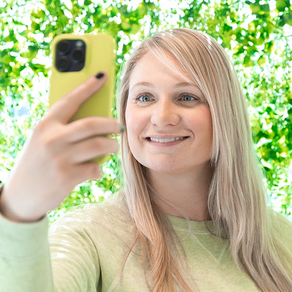 One of our Hawley Lane Dental patients taking a selfie after her dental treatment